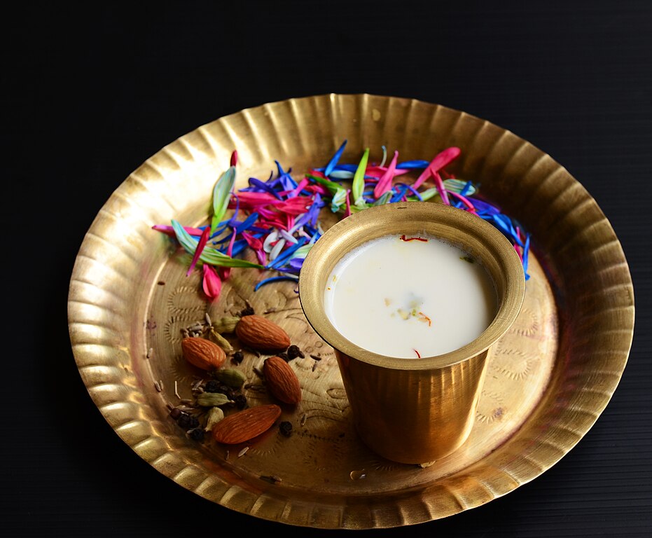 A traditional spiced milk drink made with almonds, fennel seeds, cardamom, and rose essence, especially popular during festivals like Holi.